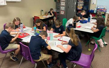 Fernandina Beach Christian Academy third grade students work through the process of opinion writing. Submitted photo
