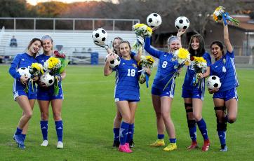 Fernandina Beach High School senior soccer players, from left, Charlee Alboher, Elaina Moore, Ansley Cutshaw, Sydney Tremaroli, Teal Lilly, Amelia Cutshaw and Presleigh Bayot were recognized before their home match Tuesday against Duval Charter. The FBHS Lady Pirates blanked their guests 9-0.