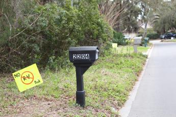 Signs on lawns in the Pirates Bay subdivision protest Breakers RV Park. Photo by Julia Roberts/News-Leader