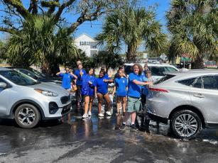 Rotary mentors and Interact Club students enjoyed a fun and successful car wash fundraiser to raise money for holiday projects. Submitted photo