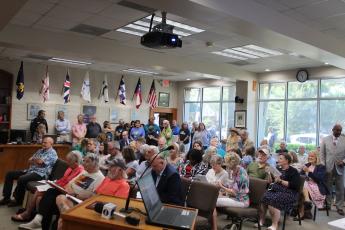 City Hall chambers was filled to overflowing to hear the quasi-judicial hearing regarding development of townhomes on what is known as the Tringali property on Third and Fourth streets in downtown Fernandina Beach. Photo by Julia Roberts/News-Leader