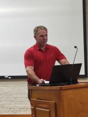 Michael Sharpe addressed the Fernandina Beach City Commission in opposition to plans for a park on the Amelia River waterfront. He said people who operate businesses out of the Fernandina Harbor Marina oppose the plan, as well. Julia Roberts/News-Leader