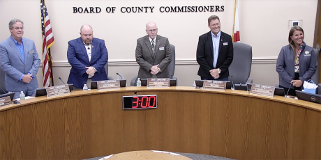 The county commissioners stand before the invocation and pledge at the Nassau County Board of County Commissioners meeting Monday. From left, Commissioner A.M. “Hupp” Huppman, Klynt Farmer, John Martin, Jeff Gray and Alyson McCullough. Submitted