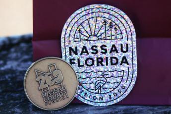 The County is handing out stickers and tokens to people who give their input for Vision 2050. To get yours, visit the Vision Tent at the Opening of the Beaches event May 18 or at the Fourth of July celebration for the towns of Hilliard and Callahan. Photo by Ashley Chandler