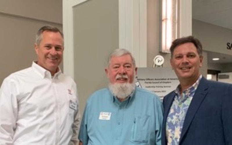 MOAA Nassau County Chapter President Mike Doran, MOAA Florida Council of Chapters President Pat Kleuver and MOAA Nassau County Chapter Vice President Tony LaVecchia, from left, stand together at annual training seminar in Orlando.