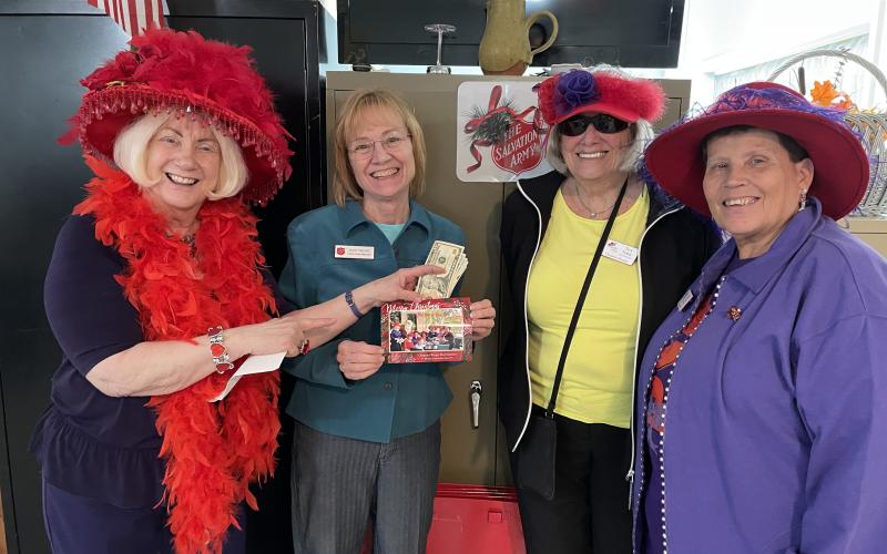 Red Hatters donate to Hope House. Submitted photo.