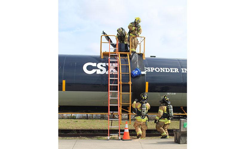 CSX personnel teach emergency responders how to deal with tanks of hazardous materials in the event of an accident involving chemicals transported by train. Photo by Julia Roberts