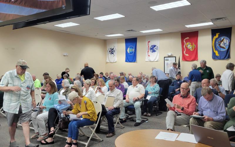 The chambers of the Nassau County Board of County Commissioners was overflowing with people asking the commission to reject a settlement offer from Riverstone Properties. However, despite the pleas, BOCC accepted the offer. Photo by Julia Robets/News-Leader