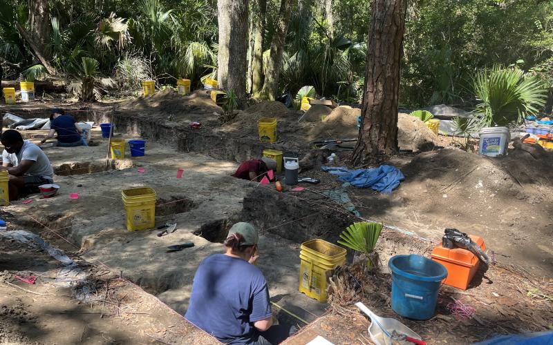 University of North Florida archeology students scoop dirt one spoonful at a time to search for artifacts. With the extra dirt, sifters rake through it searching for anything of note. Photos by Holly Dorman/News-Leader