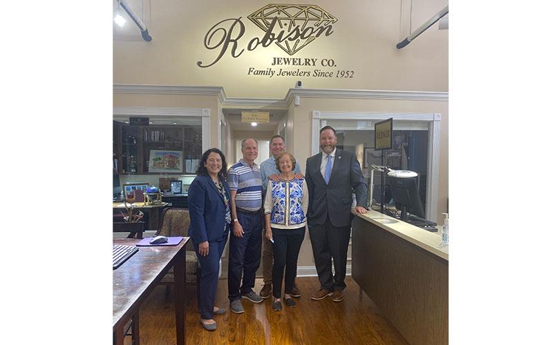 From left, Administrator Guzman, Brett Whitaker, Jeff Whitaker, Melba Whitaker and Congressman Aaron Bean in the Robinson Jewelry Company store. Photo by Tracy Dishman/News-Leader