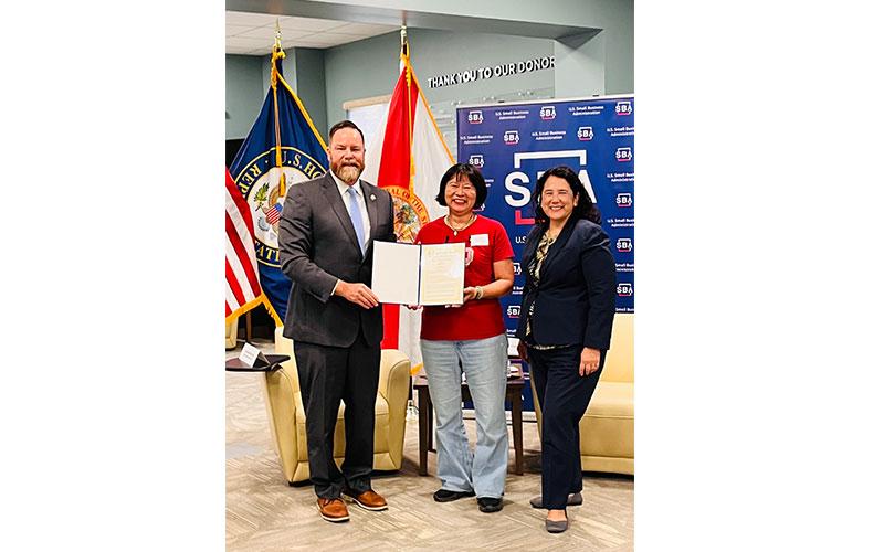 Congressman Ben and Administrator Guzman present Natalie Wu of Wicked BAO with a proclamation recognizing her recent Business Owner of the Year award from Main Street Florida. Submitted photo