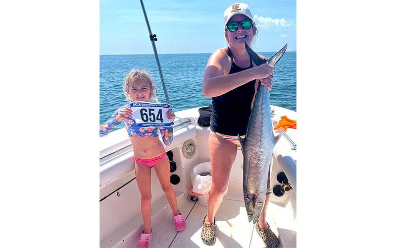 Top junior angler Ella Haddock is pictured with her mother, Colleen, and her 29.22-pound kingfish. Also fishing aboard the Miss Ella were her father, Robert Haddock Jr., Michael Scott and Bobby Jeffries. Photo by Terry Lacoss