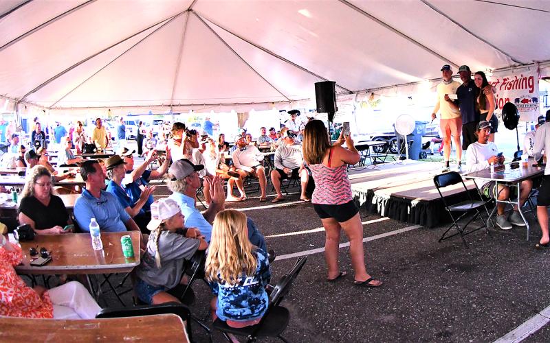 A big crowd gathered at the Fernandina Harbor Marina last year to enjoy the festivities, food and drinks and watch all the big fish being weighed in. Photo by Terry Lacoss/Special 