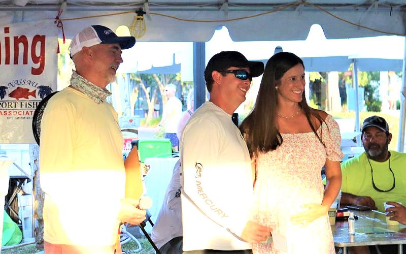 Nassau Sport Fishing Association President Shawn Arnold is pictured with top lady angler Flossy Ross and her husband, Spencer Ross, above left, at the awards ceremony last year. Photo by Terry Lacoss/Special