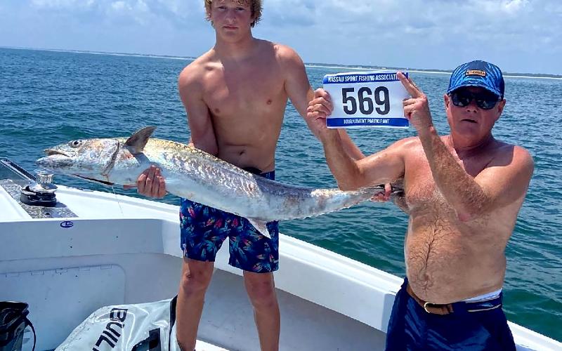 David Mapson, Neal Hammons, Tristan Mapson and Justin Hammons, from left, are pictured with their first-place kingfish, weighing an impressive 47.7 pounds. Team Taking the Bait took home the top prize of $10,000. Photo by Terry Lacoss