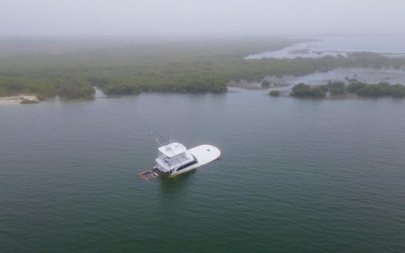 A 54-foot, $1.2 million boat sinks after a collision that killed an endangered North Atlantic right whale calf and severely injured its mother in 2021 near St. Augustine. Photos courtesy Florida Fish and Wildlife Conservation Commission
