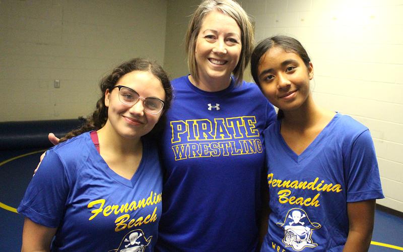 FBHS head girls wrestling coach Erin Mahoney is flanked by team members Audrey Miller, left, and Anjana Sermadevi. Photo by Beth Jones/News-Leader