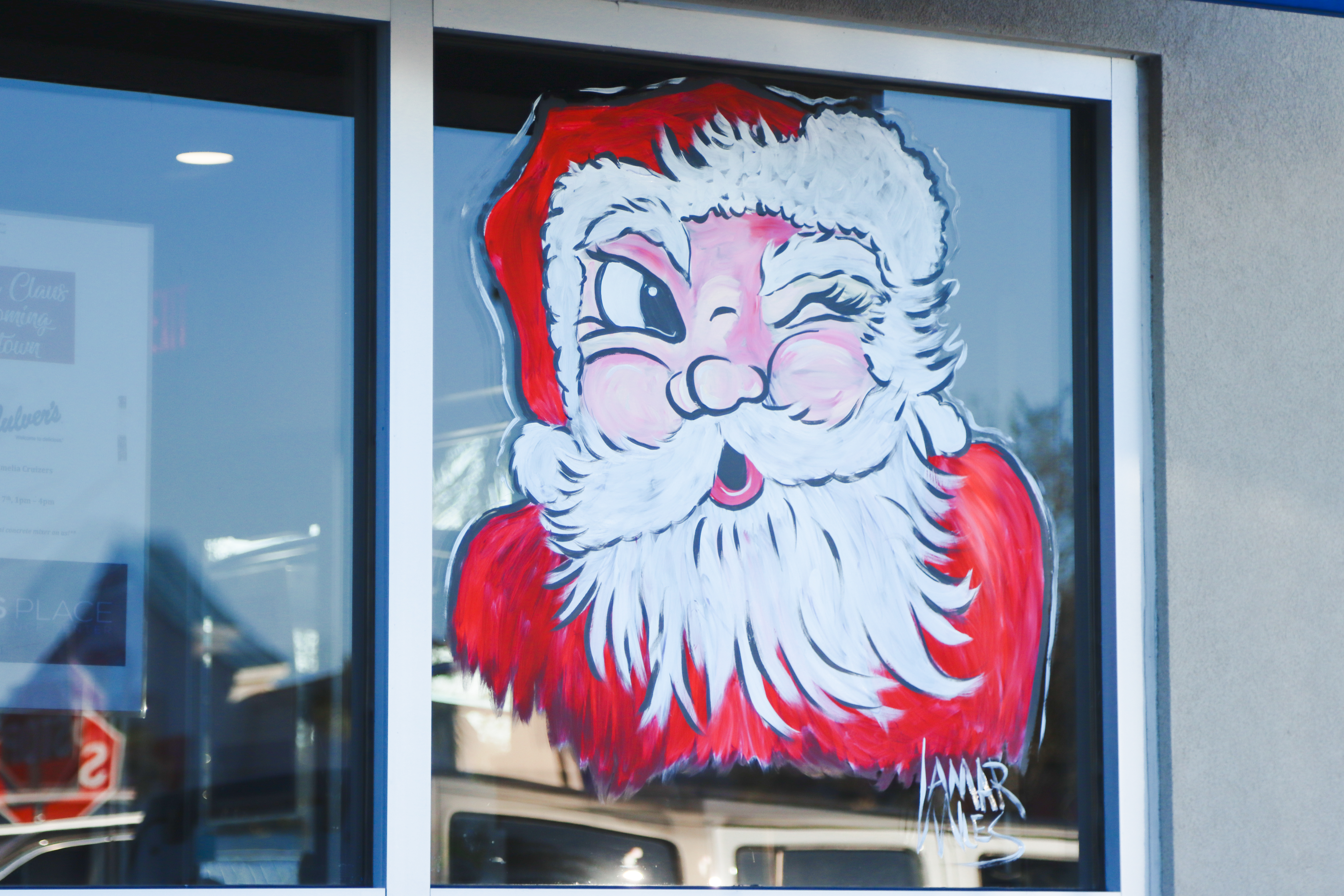 Lamar Miles of Ugly Fish Art Company painted the windows at Culver’s with the help of Robyn Mejia. Photo by Ashley Chandler/News-Leader