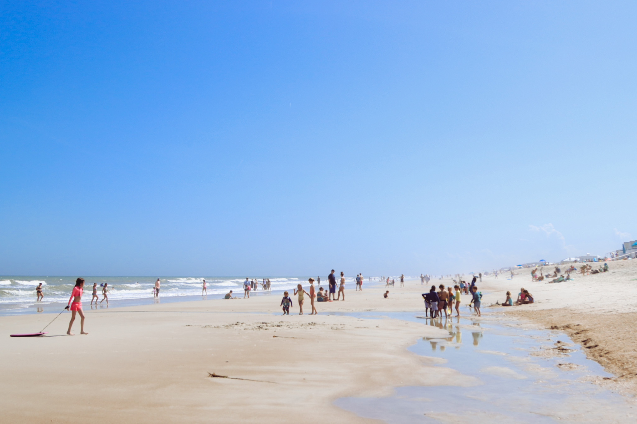 Visitors of Main Beach enjoy the warming weather in April. Photo by Ashley Chandler/News-Leader