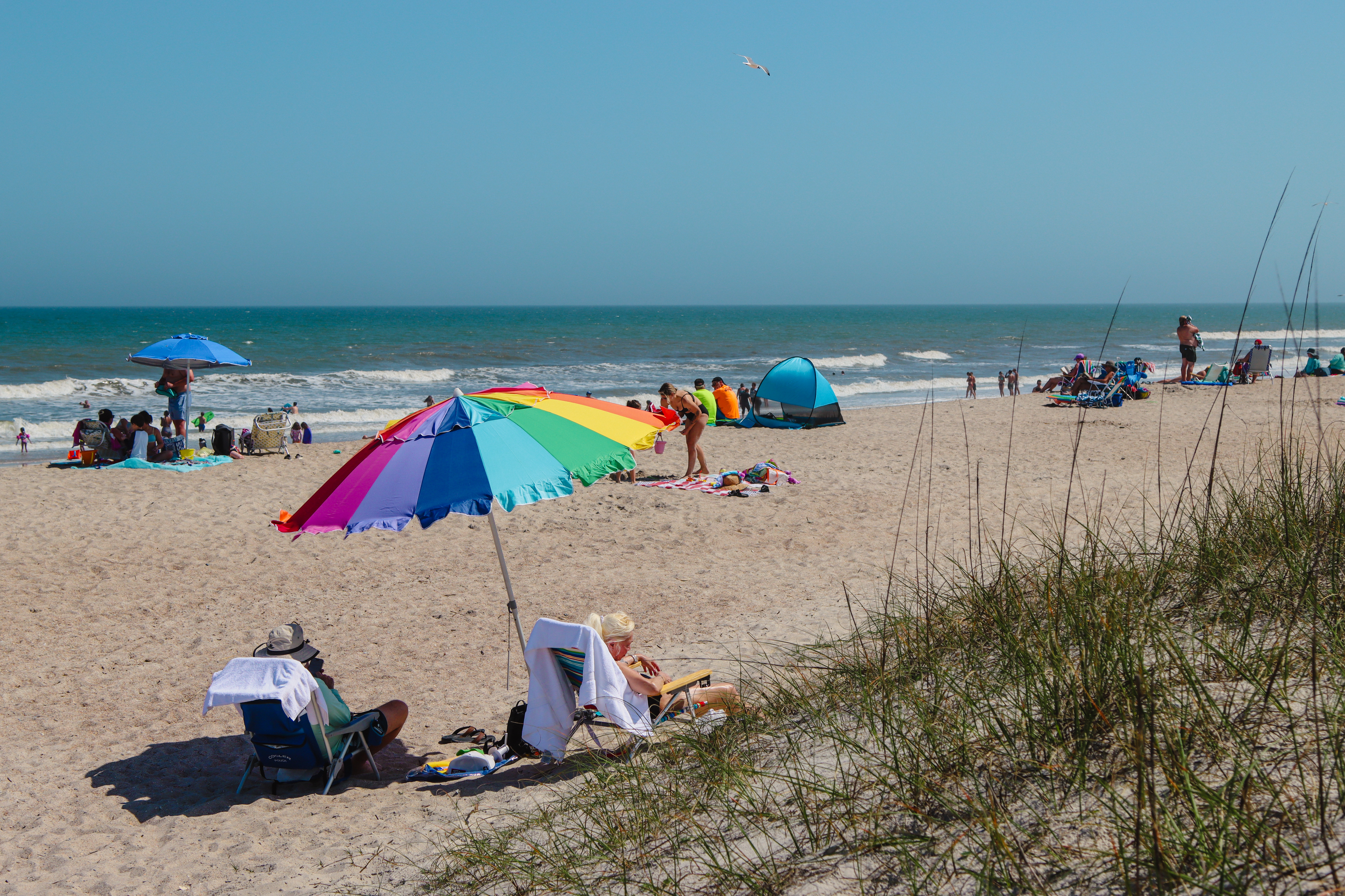 Visitors of Main Beach enjoy the warming weather in April. Photo by Ashley Chandler/News-Leader