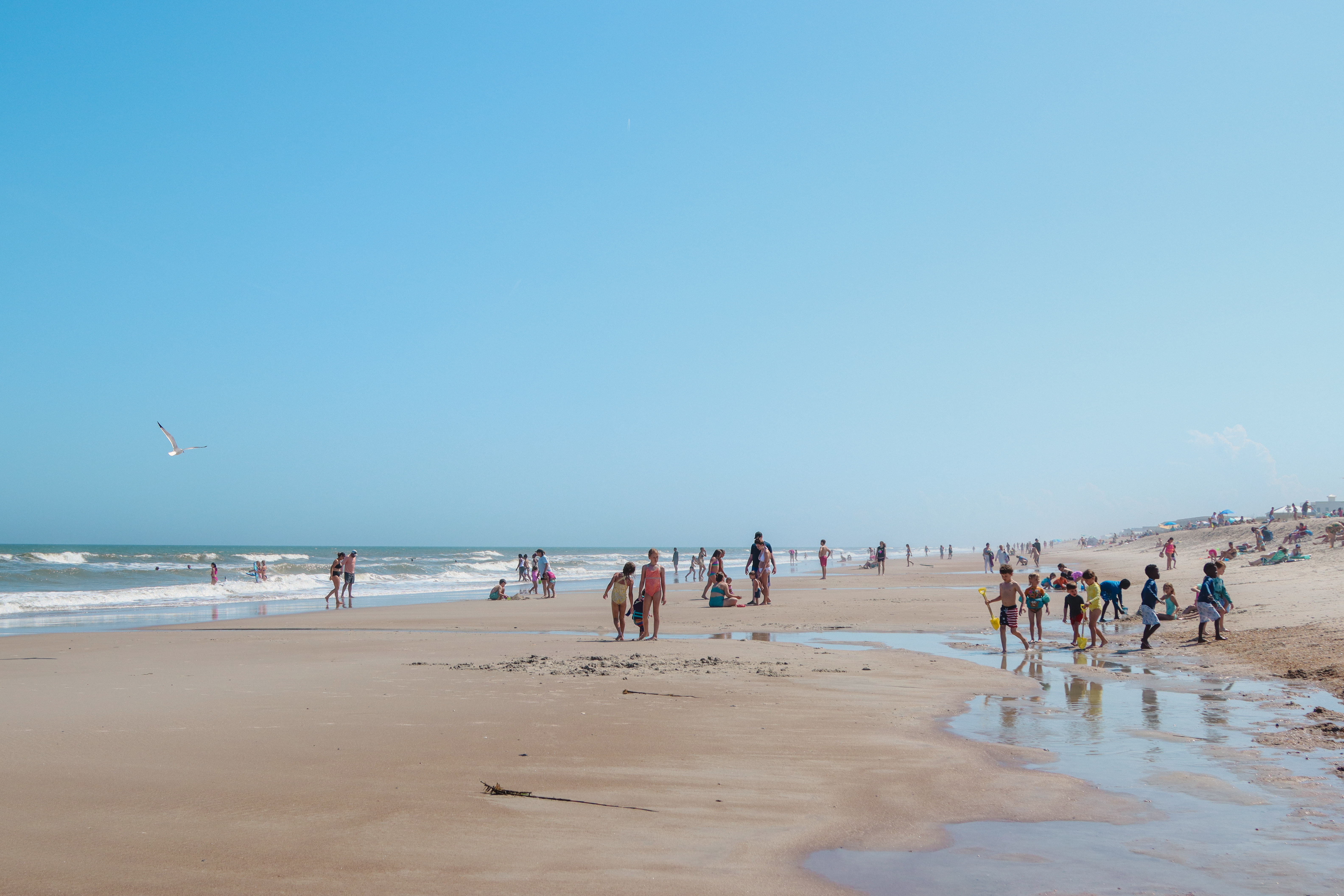 Visitors of Main Beach enjoy the warming weather in April. Photo by Ashley Chandler/News-Leader