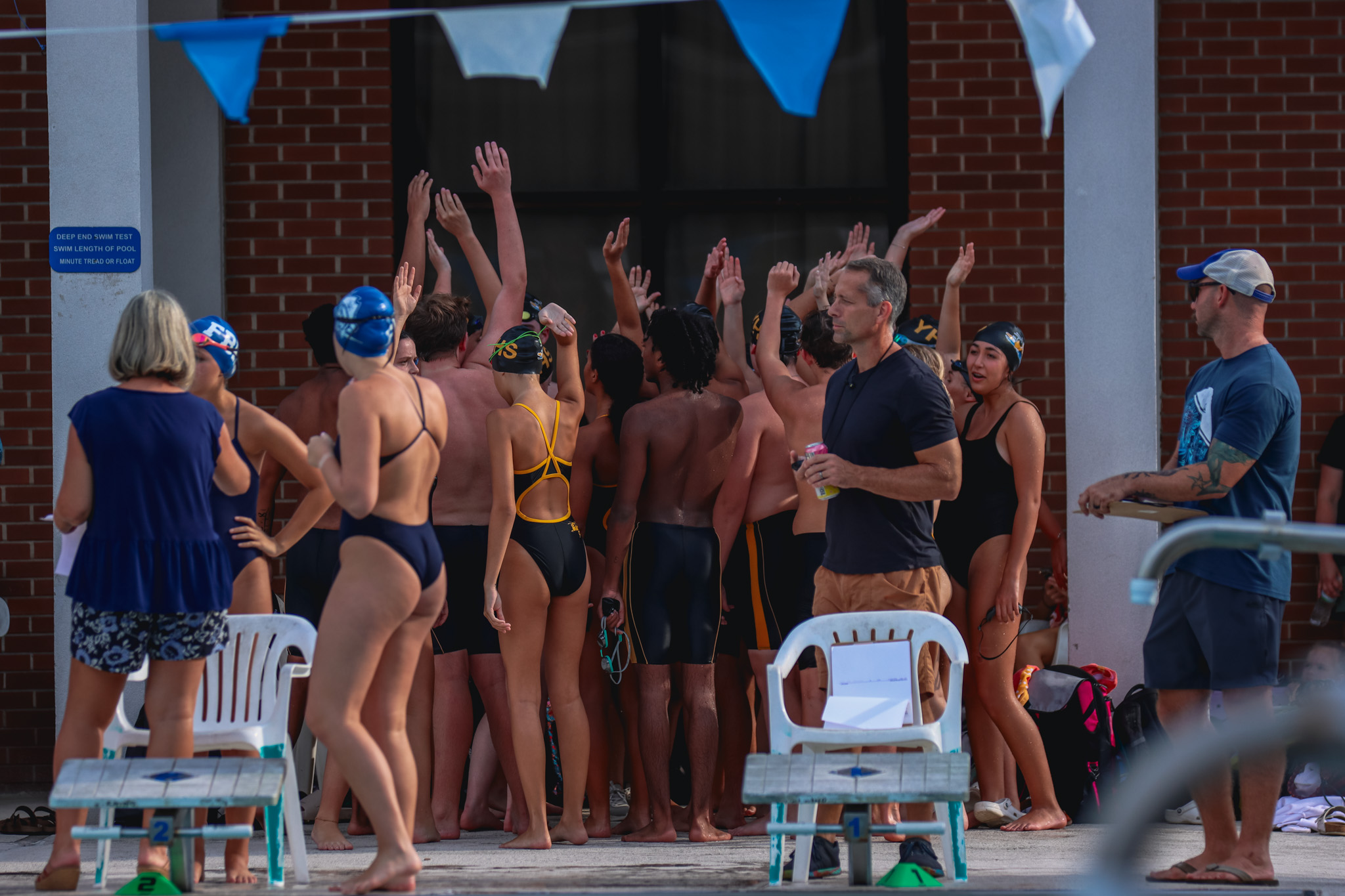 Yulee swimmers before a meet at the Atlantic Recreation Center in August. Photo by Ashley Chandler/News-Leader