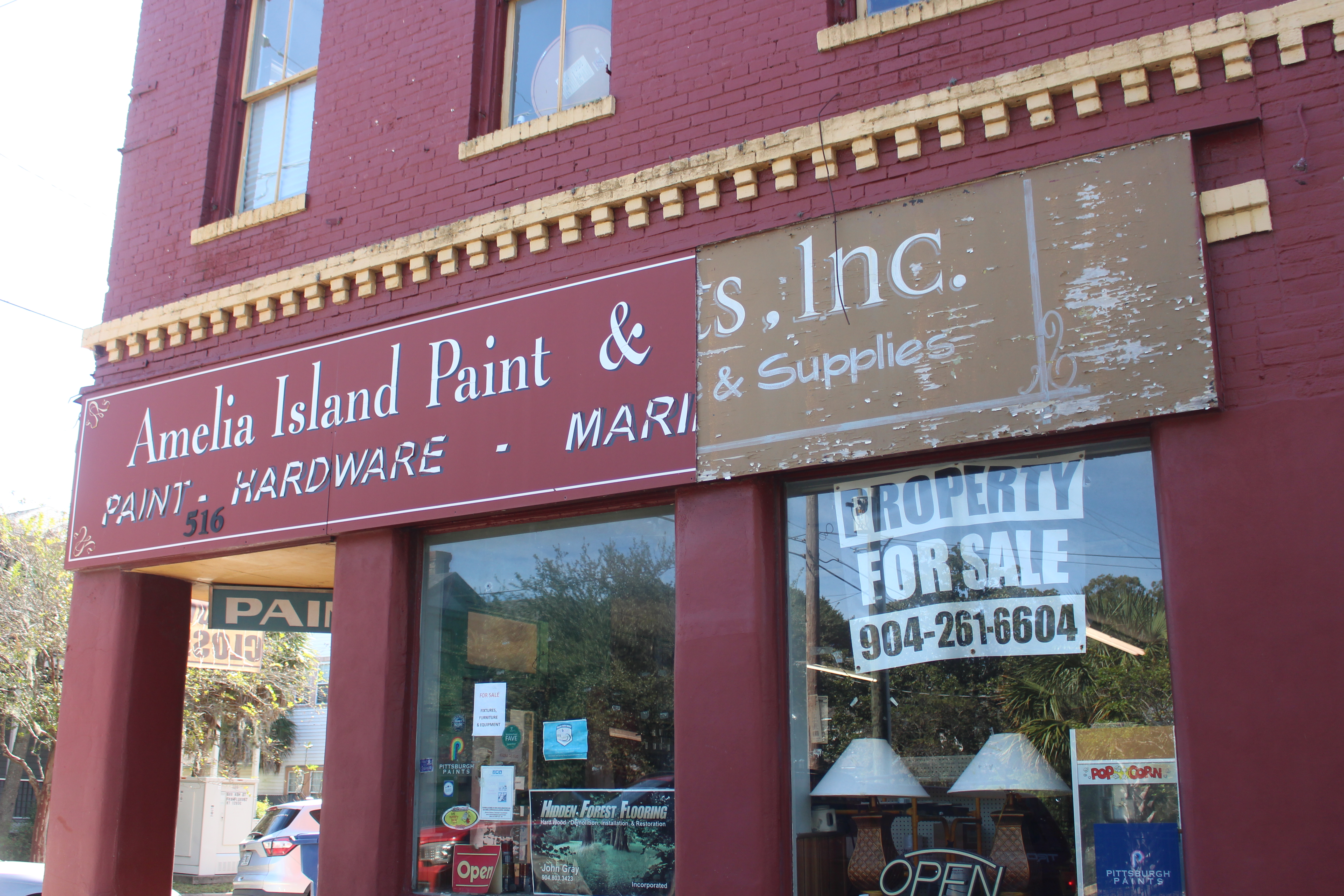 Amelia Paint Inc's closing sign hangs on the storefront on Ash Street in Fernandina Beach on Oct 23.  Marisa DeMar/News-Leader