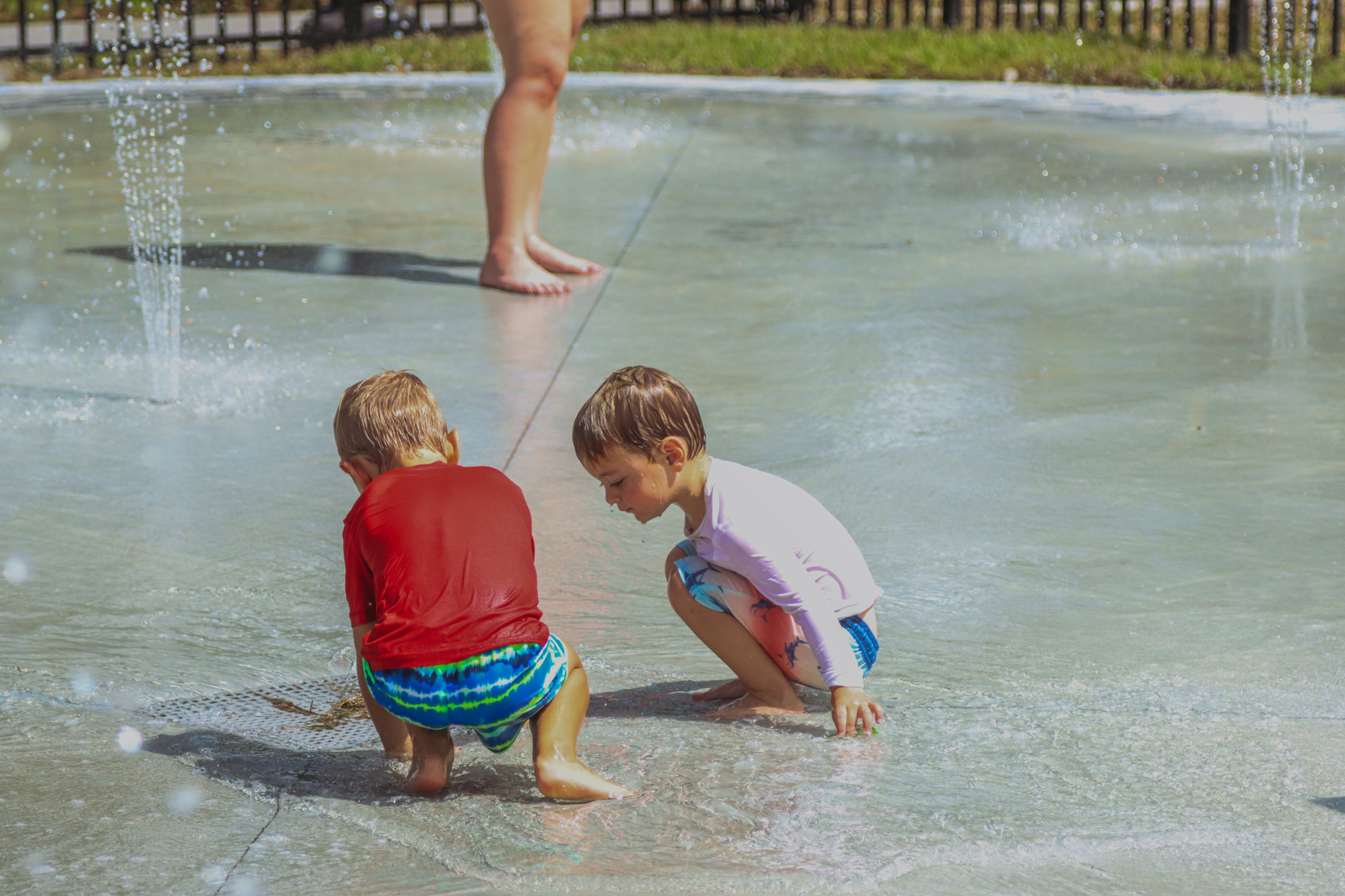 Cooper Trout, left, and Asher Sereda play at the splash pad Sept. 26 after its official opening. The two have been anxiously awaiting its opening, their mothers Michele and Halee told the News-Leader. Photo by Ashley Chandler/News-Leader
