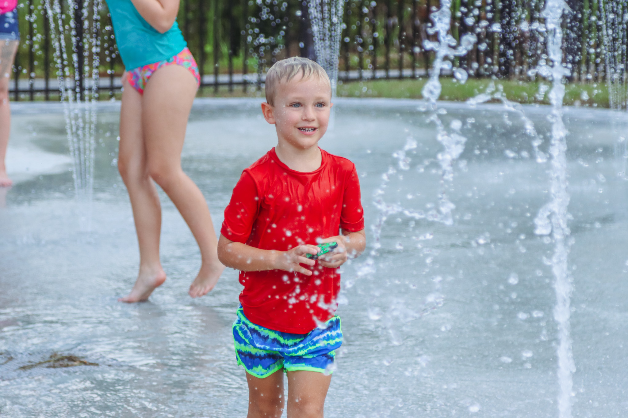 Cooper trout plays at the splash pad Sept. 26. Photo by Ashley Chandler/News-Leader