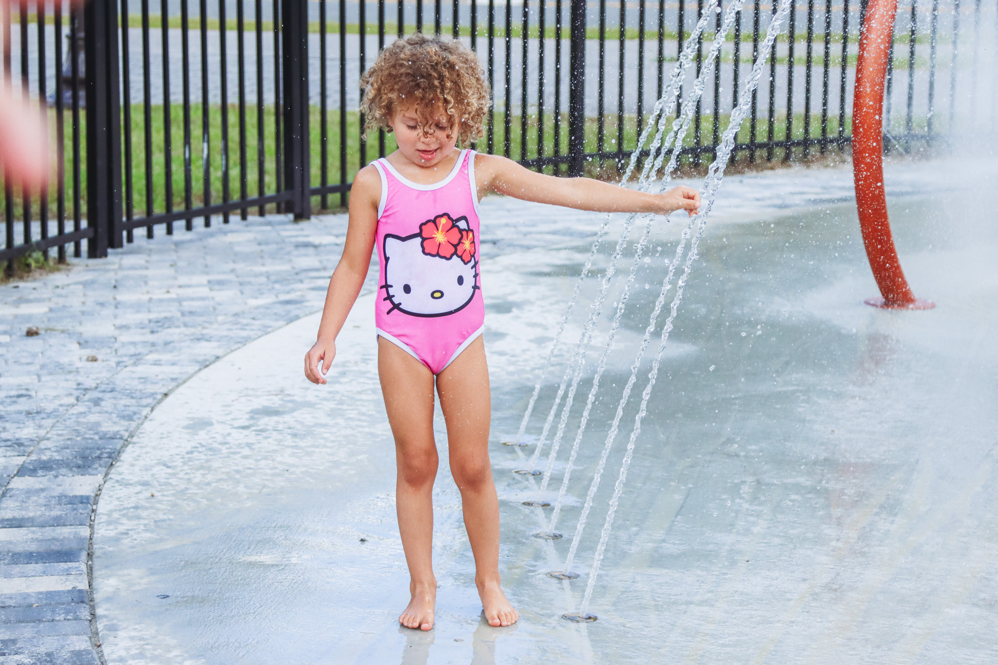 Hazel Tarantini plays at the splash pad Sept. 26. Photo by Ashley Chandler/News-Leader