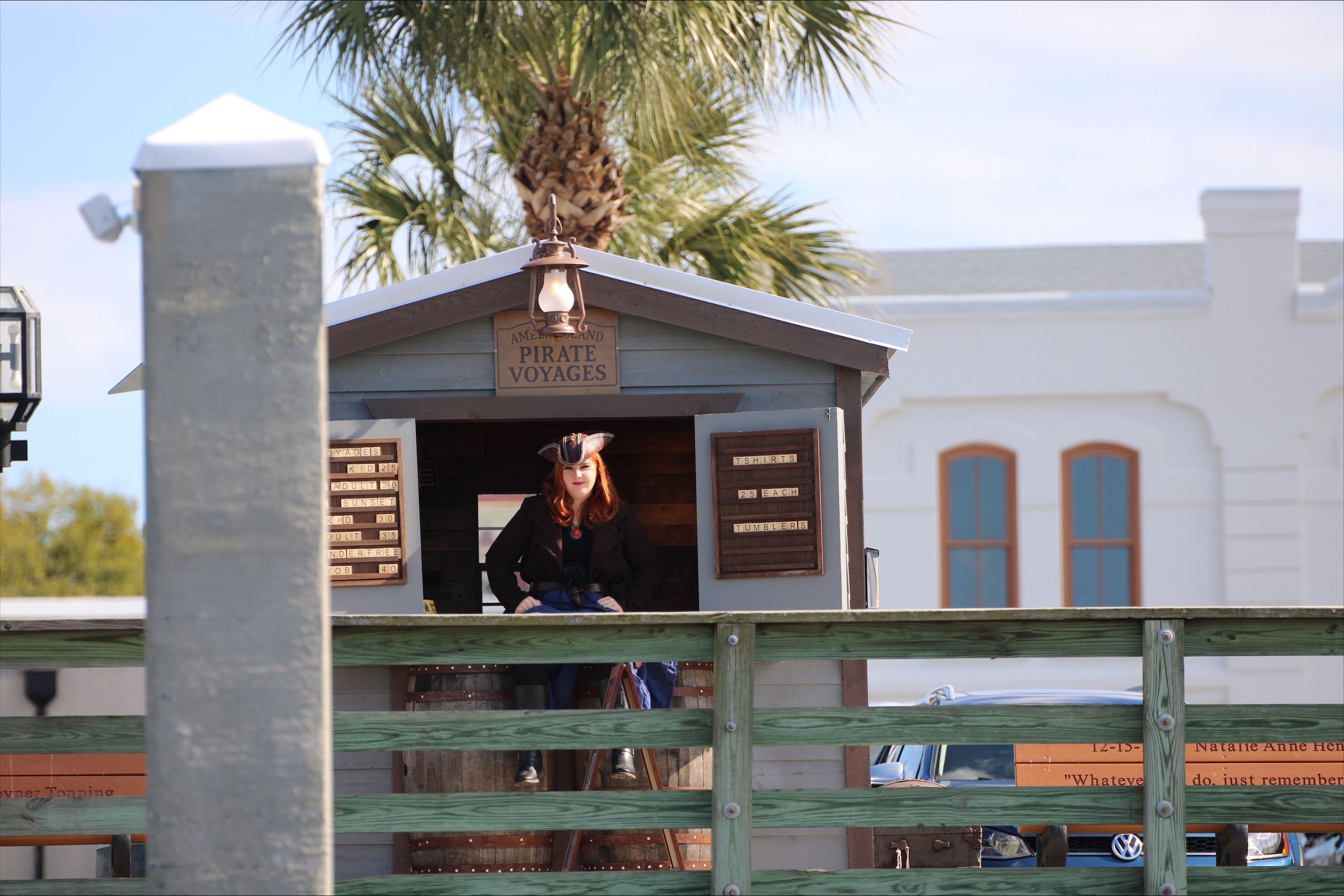 Kaydance Fedroff outside of the Amelia Pirate Voyages booth at the Fernandina Marina Harbor. By Marisa DeMar/News-Leader 