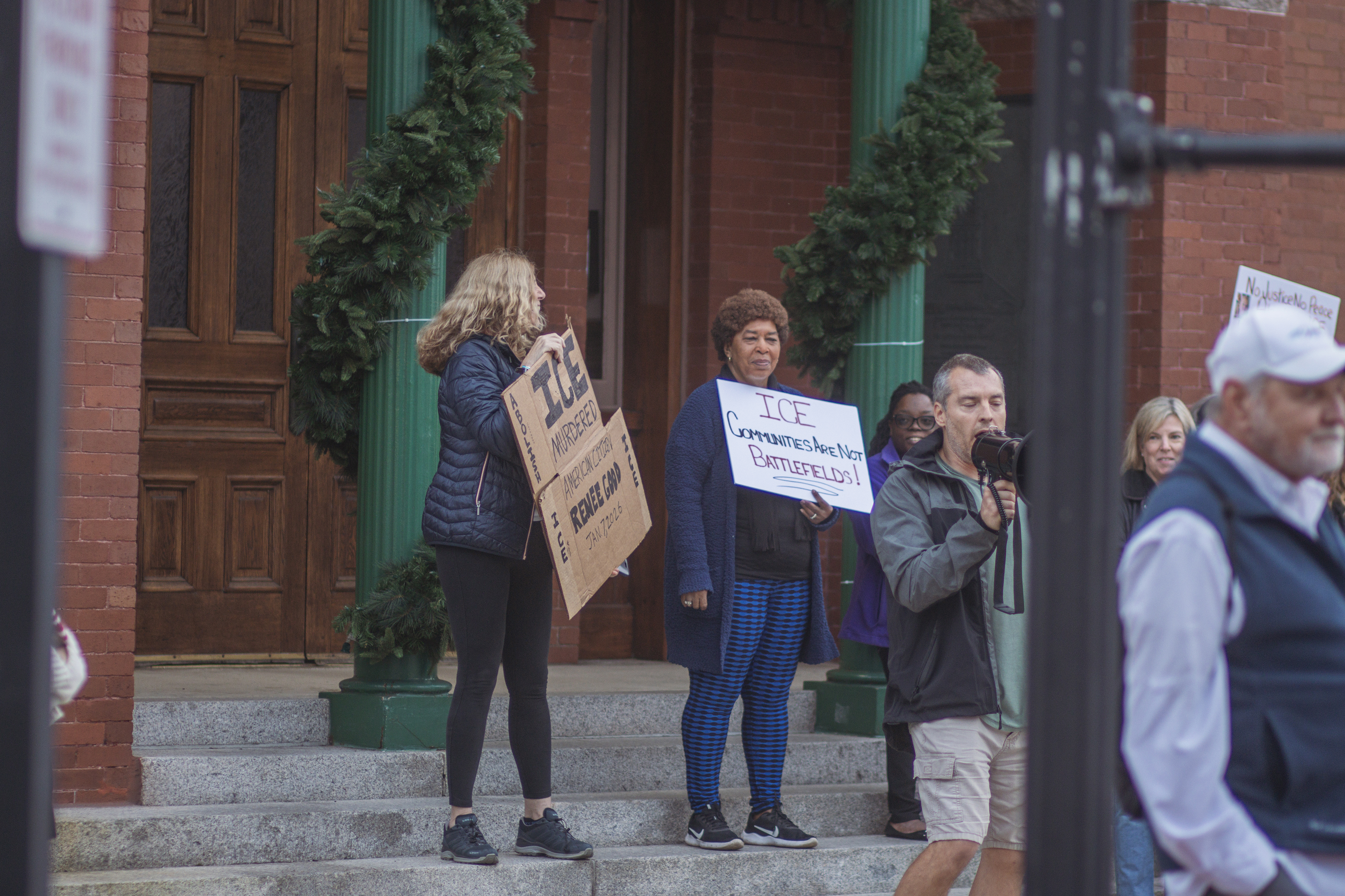 Local demonstrators protest the actions of an ICE agent in Minneapolis last week in front of the Downtown Historic Courthouse. Photo by Ashley Chandler/News-Leader