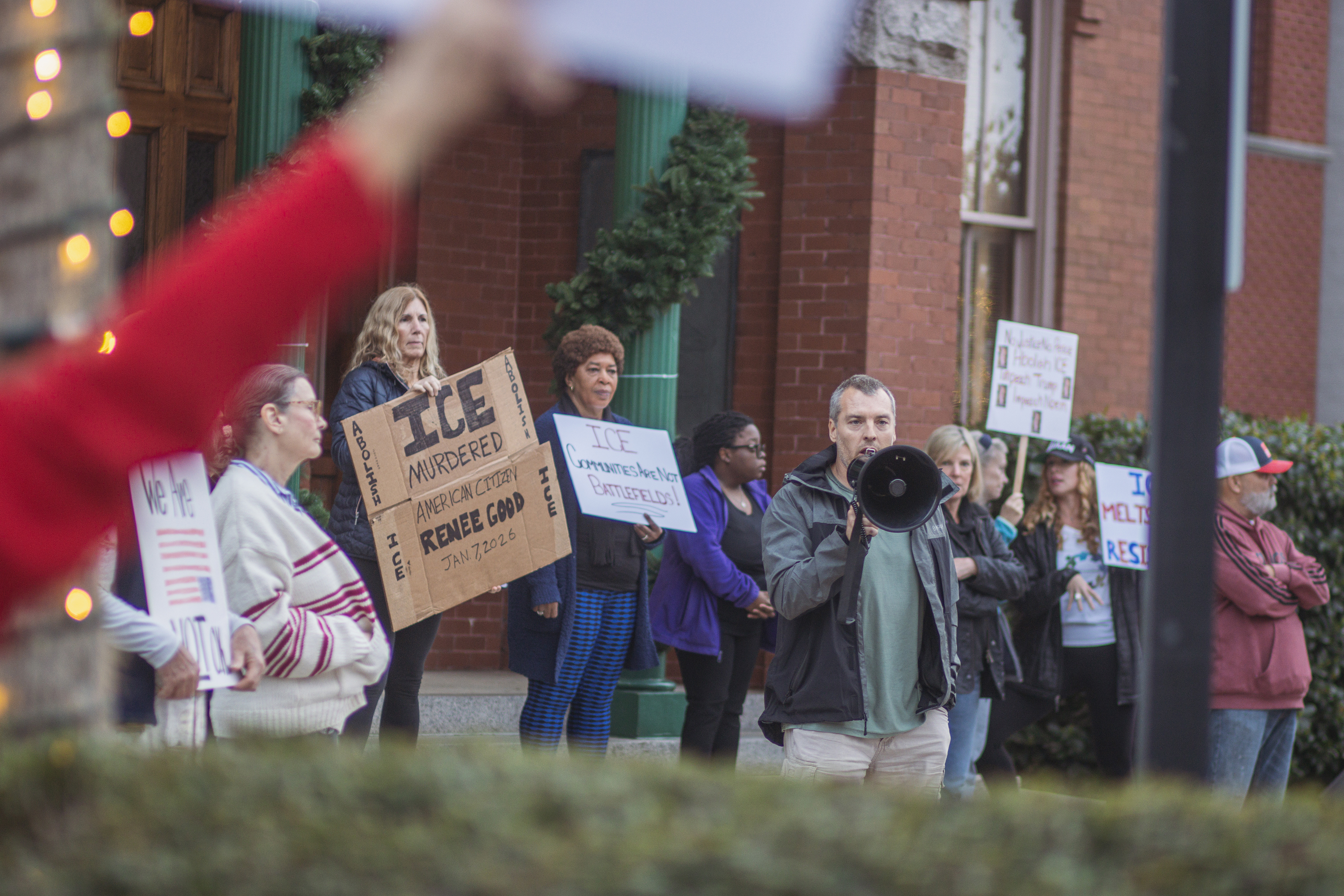 Local demonstrators protest the actions of an ICE agent in Minneapolis last week in front of the Downtown Historic Courthouse. Photo by Ashley Chandler/News-Leader