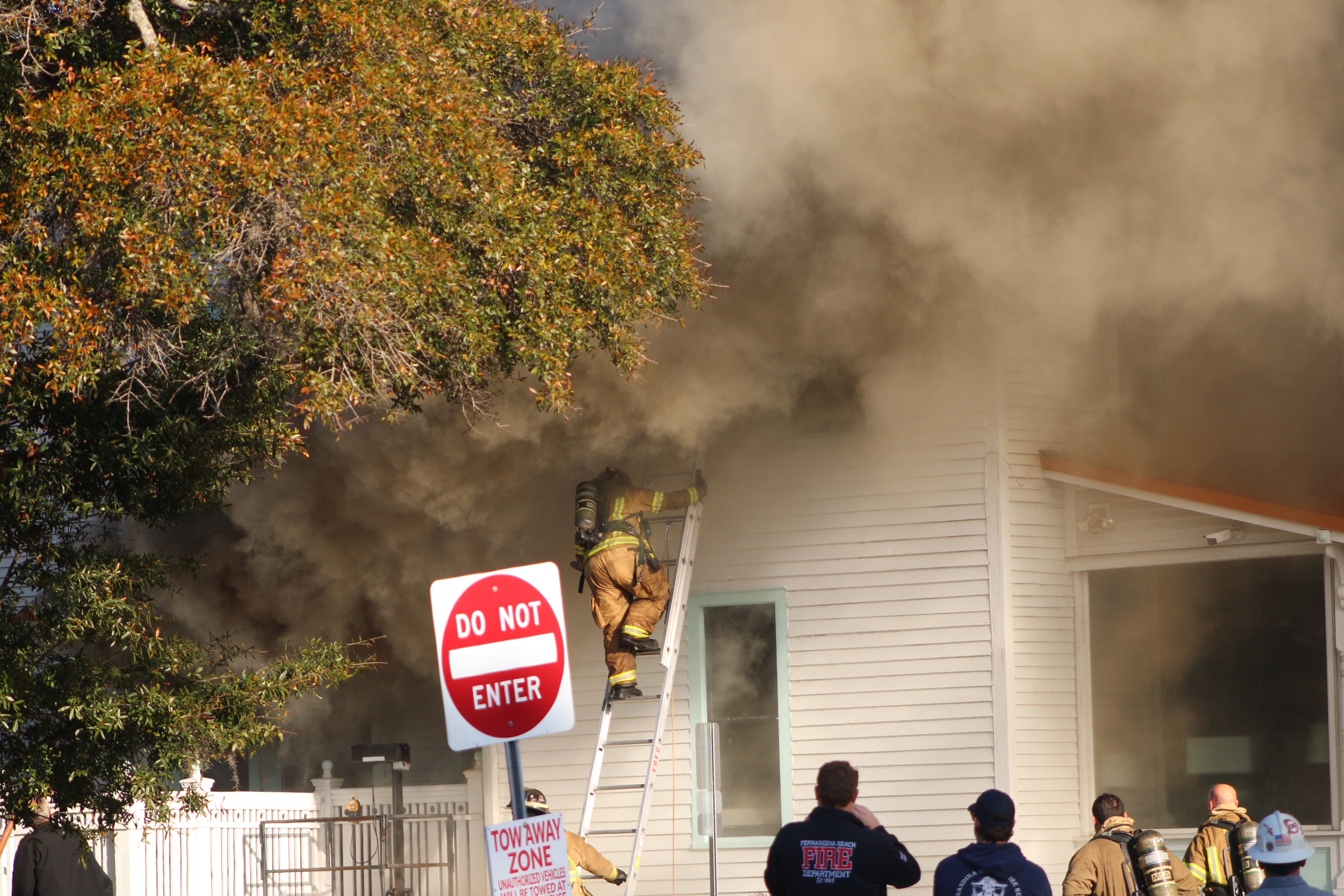 Smoke engulfs Isola Home in Fernandina as firefighters battle flames. By Marisa DeMar 
