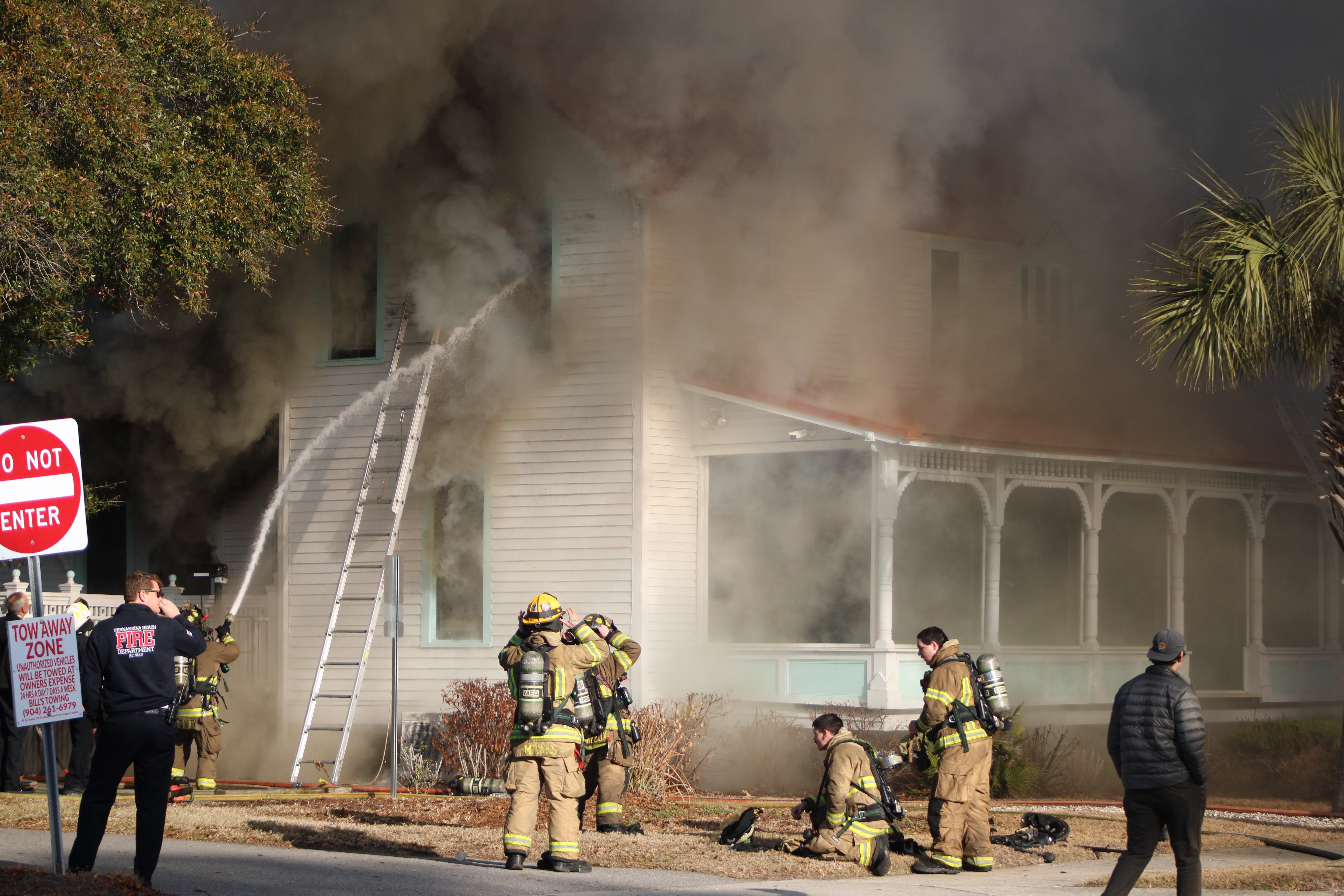 Smoke engulfs Isola Home in Fernandina as firefighters battle flames. By Marisa DeMar 