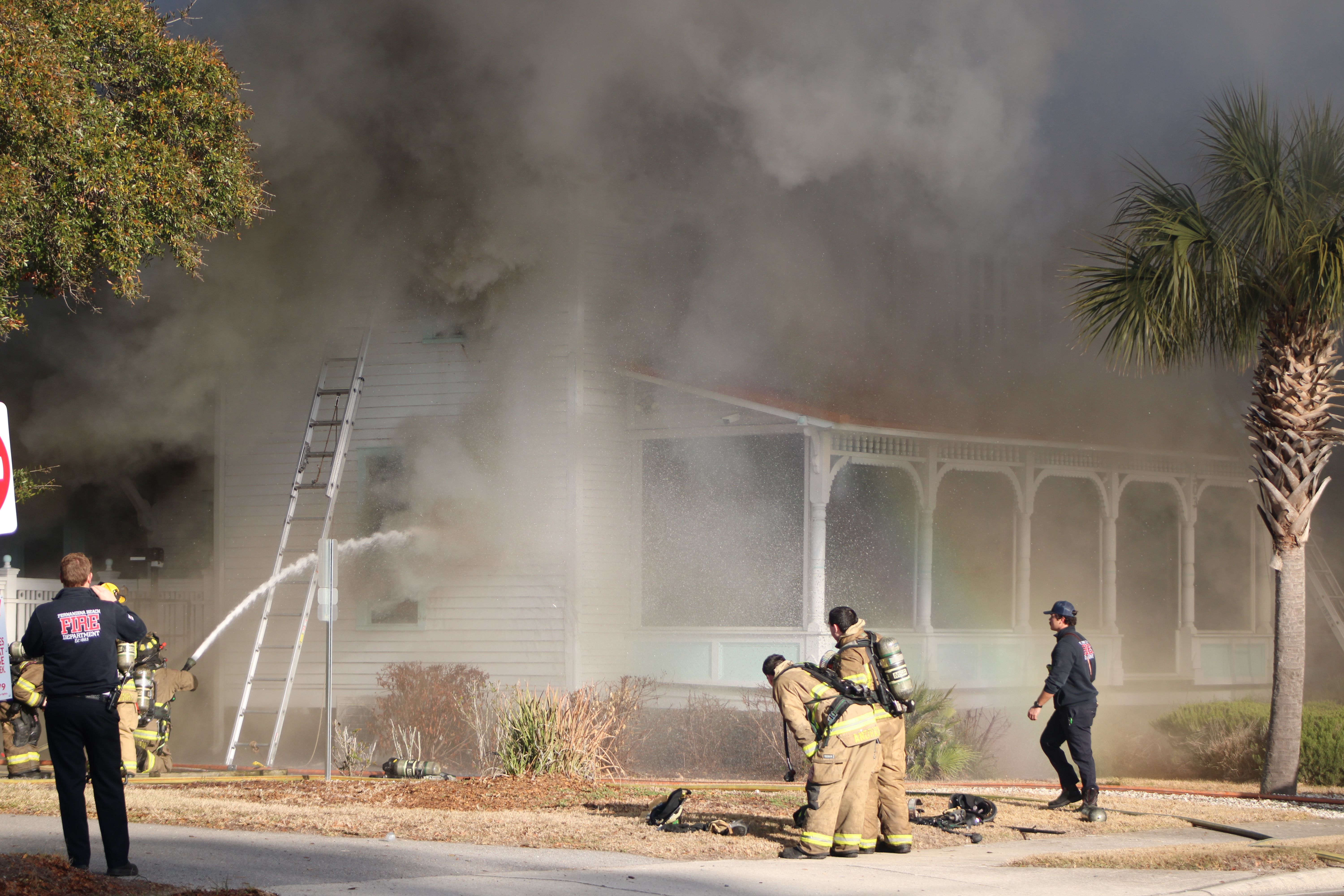 Smoke engulfs Isola Home in Fernandina as firefighters battle flames. By Marisa DeMar 
