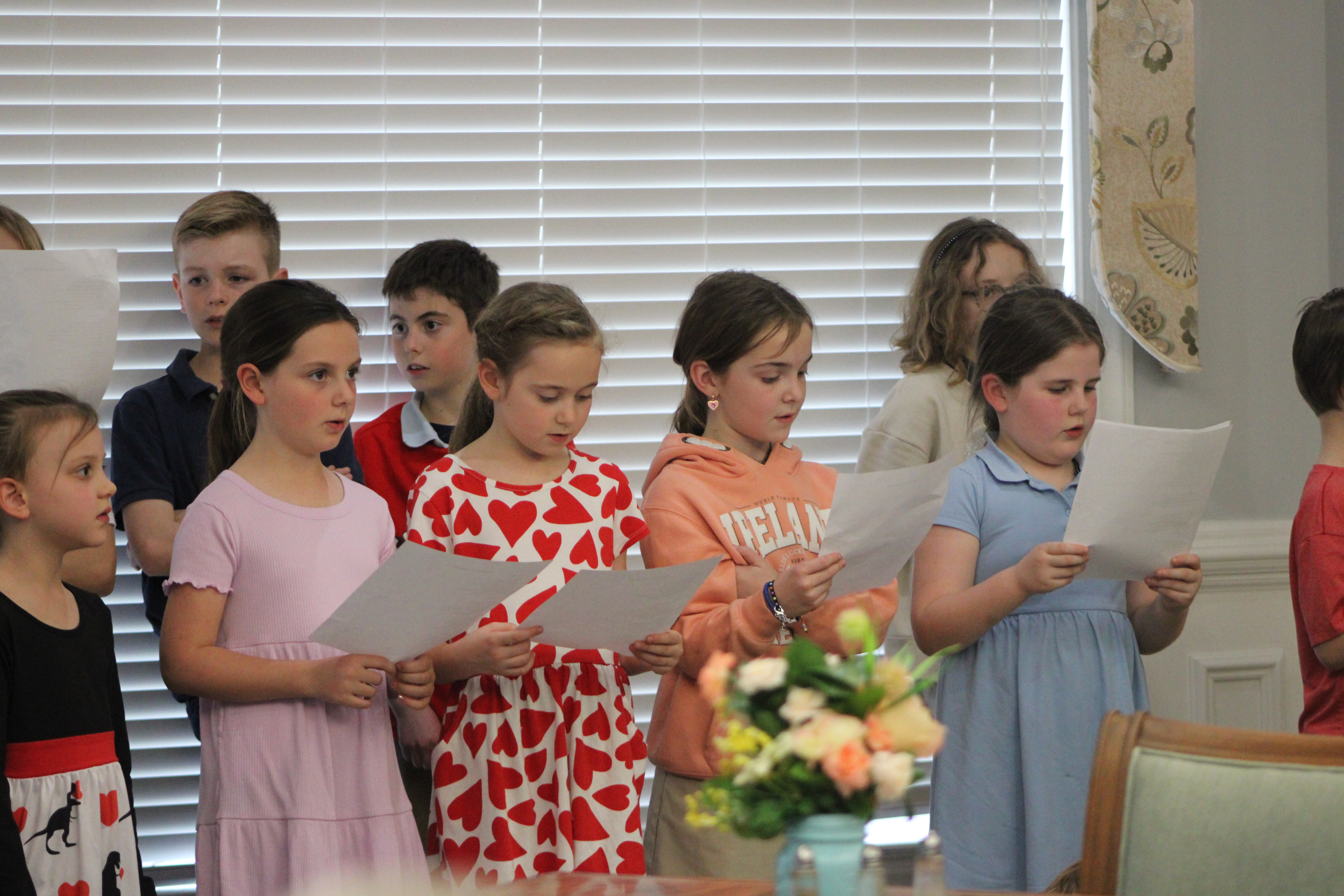 Amelia Island Montessori School students sing at the Osprey Village assisted living facility for Valentine's Day. By Marisa DeMar/News-Leader