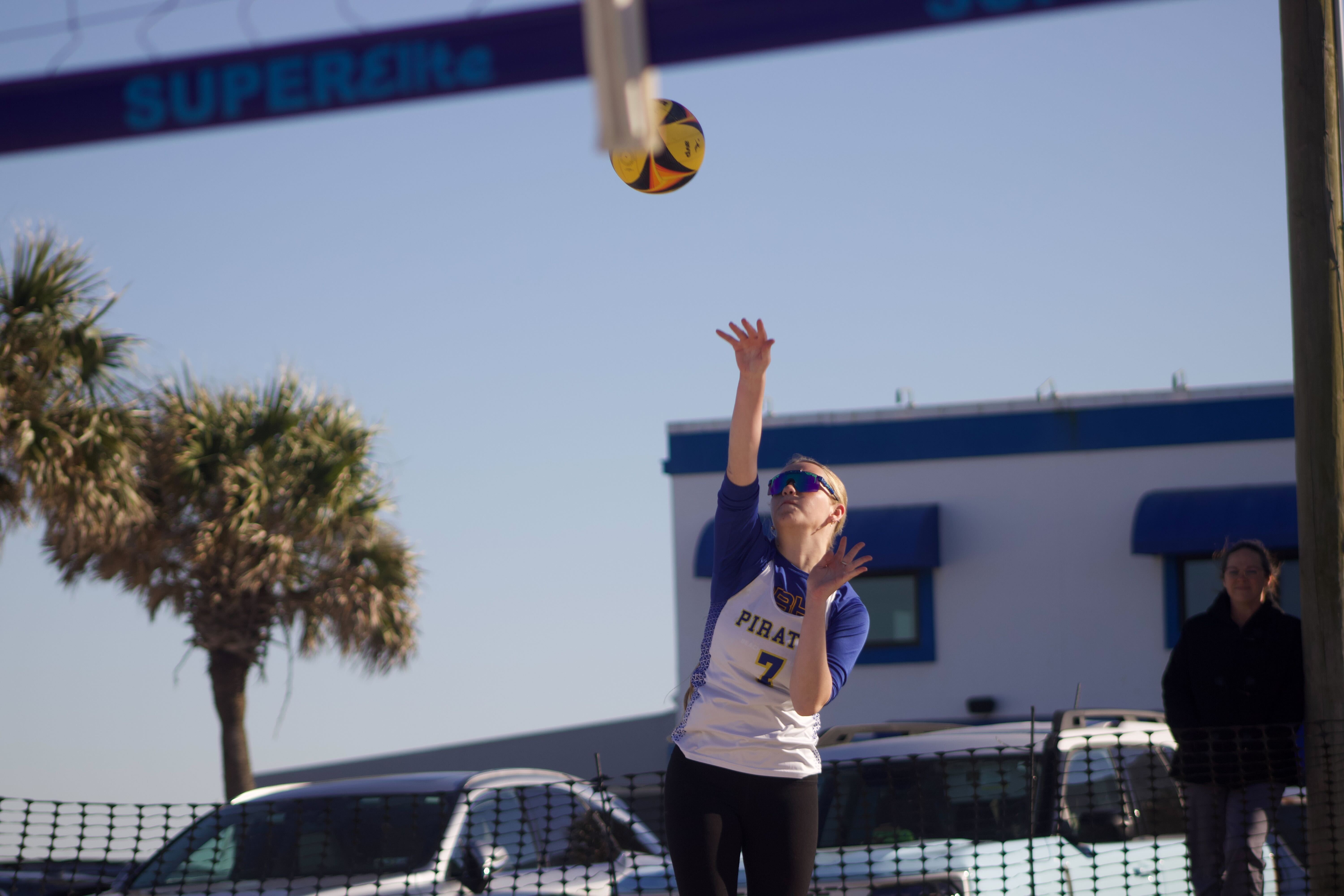 Fernandina Beach’s Olivia Rousselow serves the ball in a beach volleyball match Monday against Clay. Photo by Marisa DeMar/News-Leader