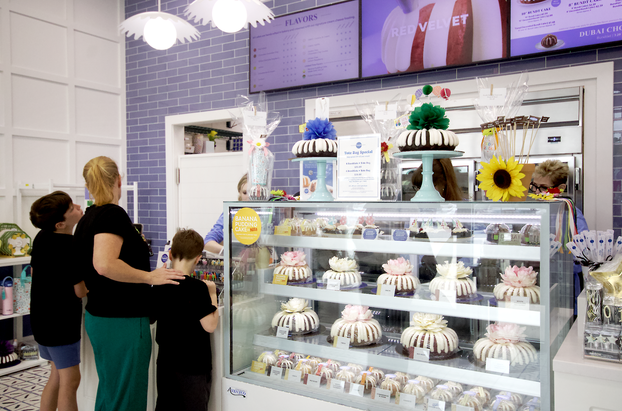 Customers line up to purchase cakes during the soft opening of Nothing Bundt Cakes in Yulee on Monday. By Marisa DeMar 