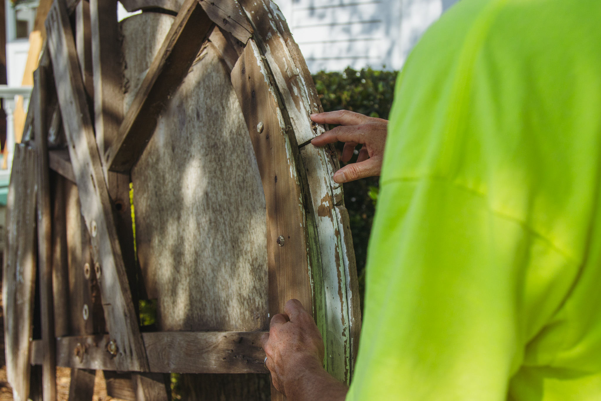 Nate Whitaker talks about the old bell wheel from the historic First Presbyterian Church bell on Tuesday. Photo by Ashley Chandler/News-Leader