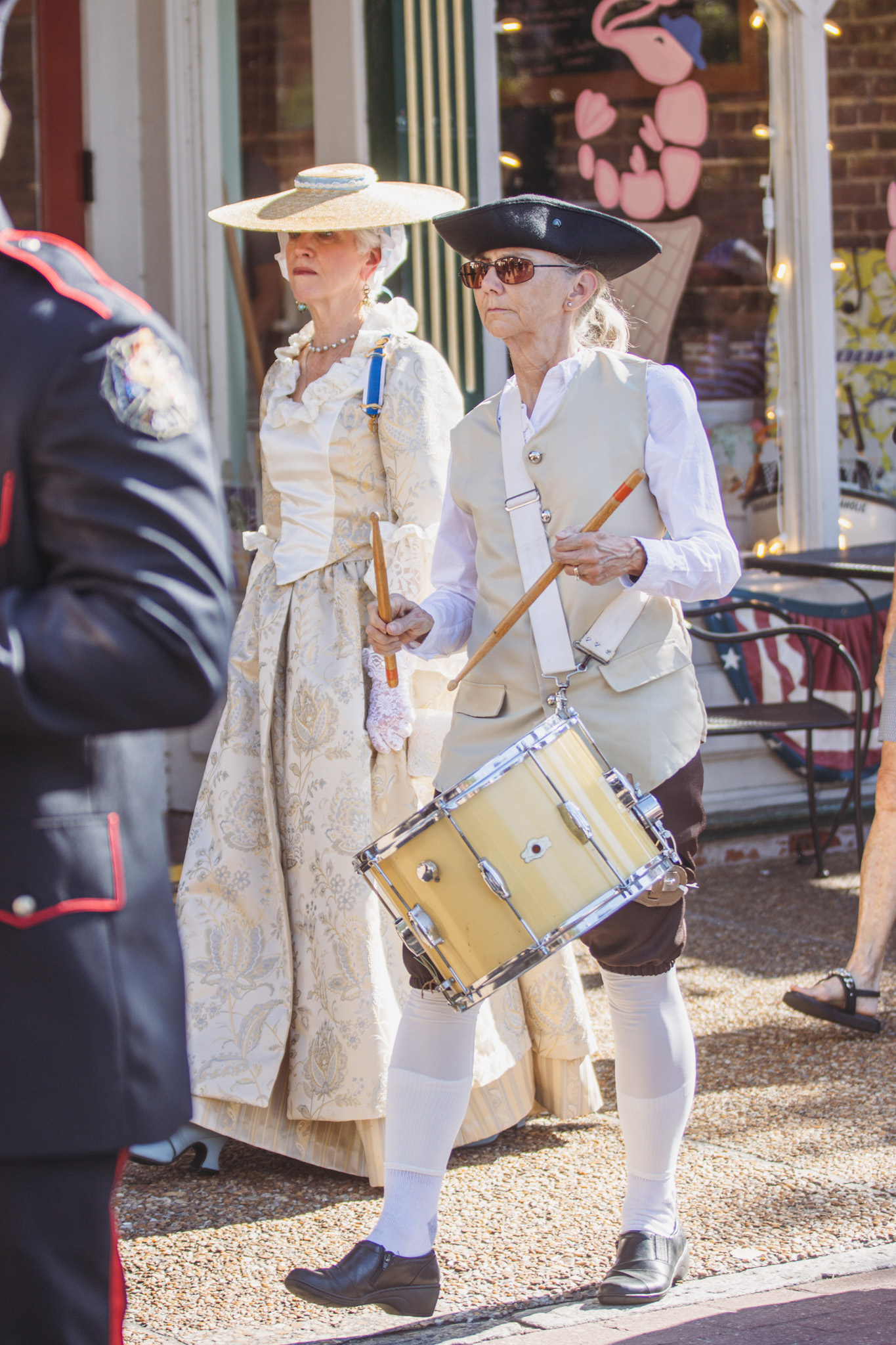 Margaret Surber, with Amelia Island Chapter of the National Society of the Daughters of the American Revolution and Nassau Community Band, plays the drum during the promenade to the Historic County Courthouse on Centre Street. Photo by Ashley Chandler/News-Leader