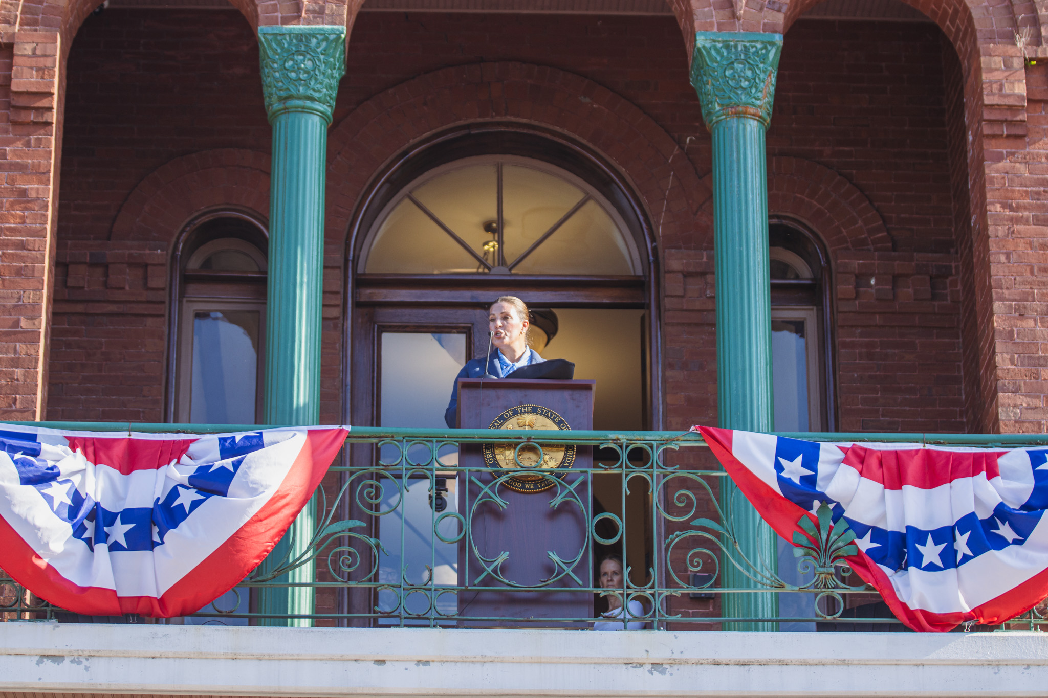 Nassau County Commissioner Alyson McCullough reads part of the Declaration of Independence. Photo by Ashley Chandler/News-Leader
