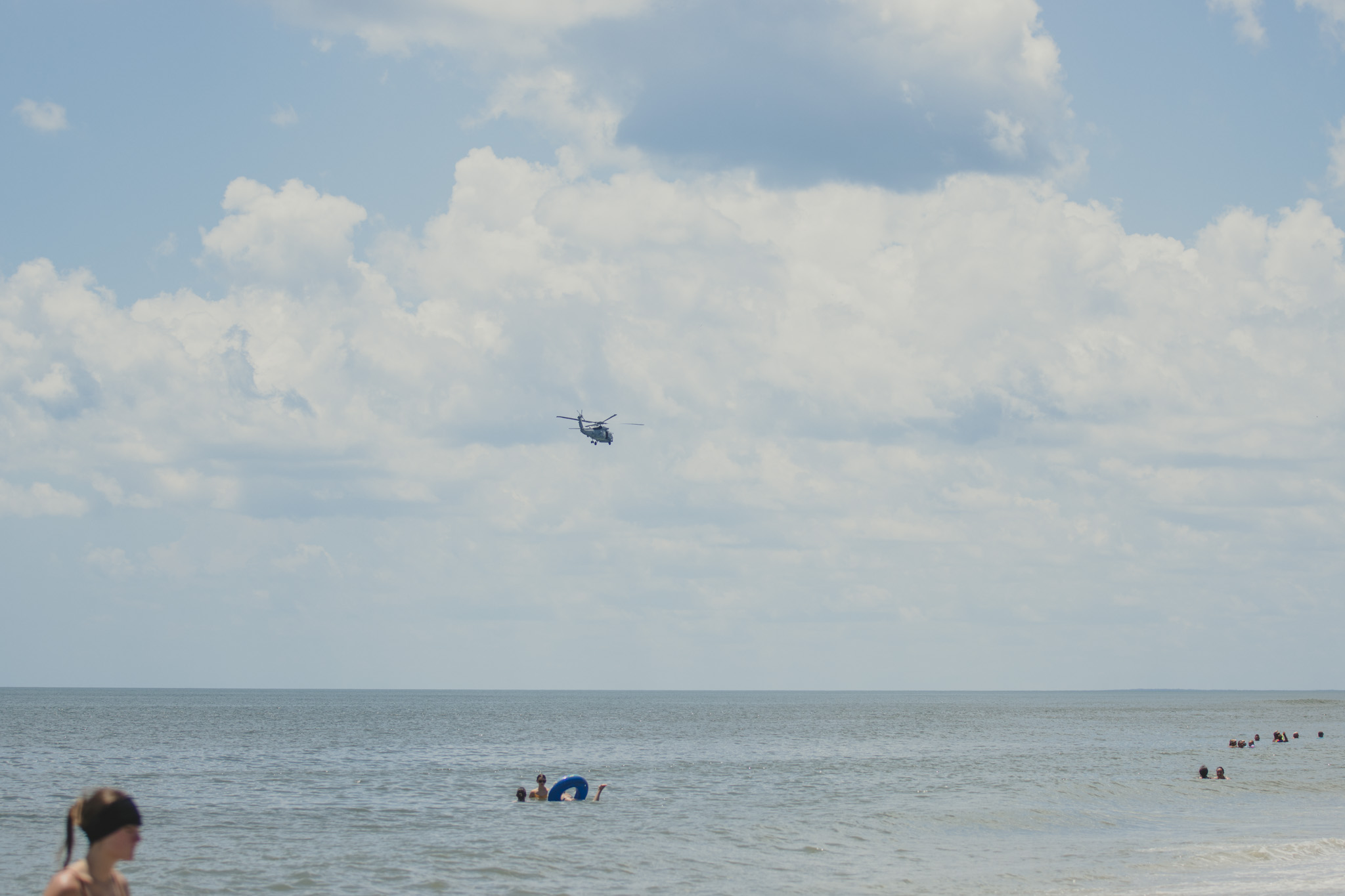 A helicopter flies over Main Beach on July 7. Photo by Ashley Chandler/News-Leader