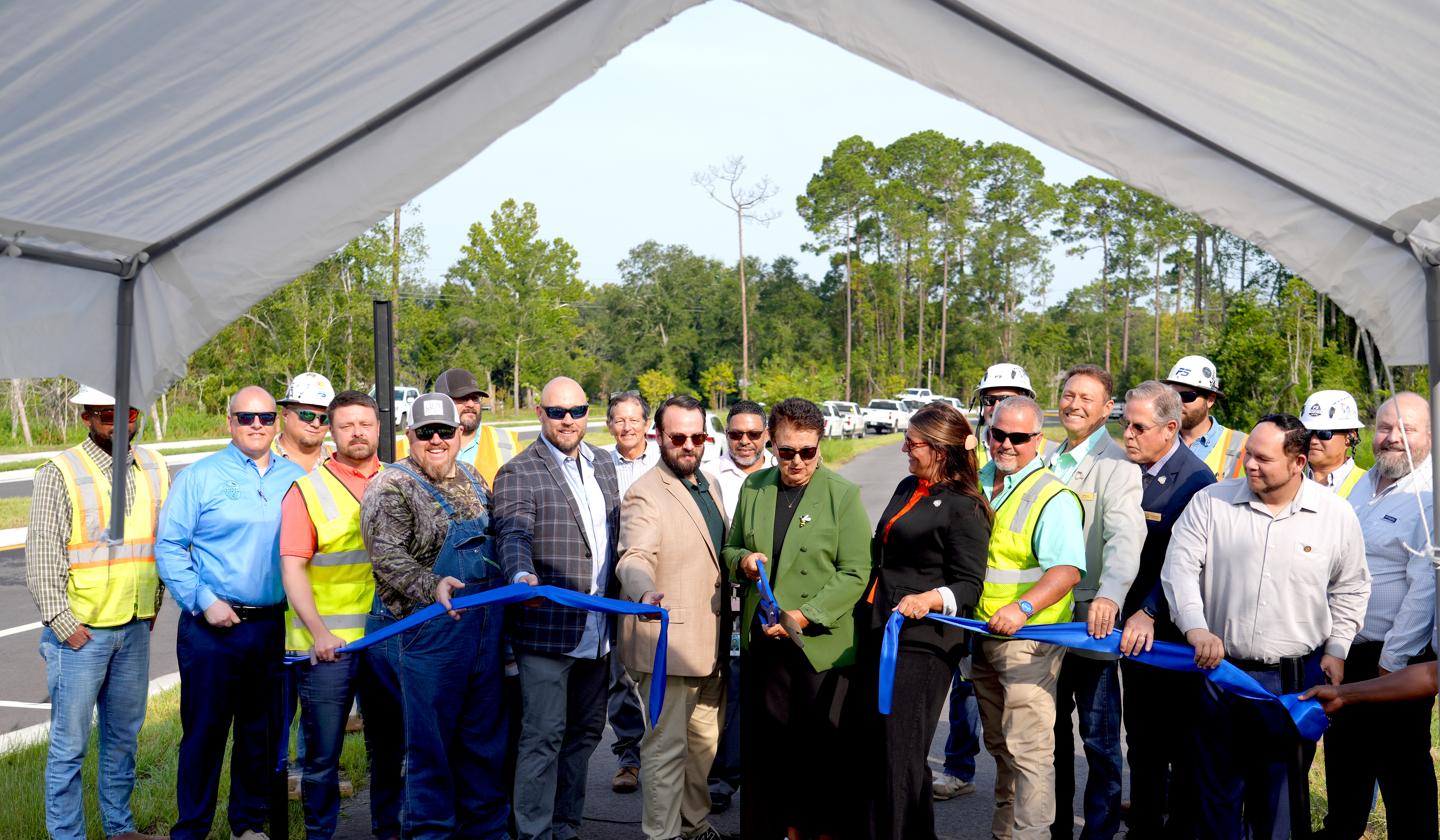 Nassau County School Superintendent Kathy Burns cuts the ribbon for Hornets Drive, formally know as William Burgess Extension. Photo courtesy of Nassau County