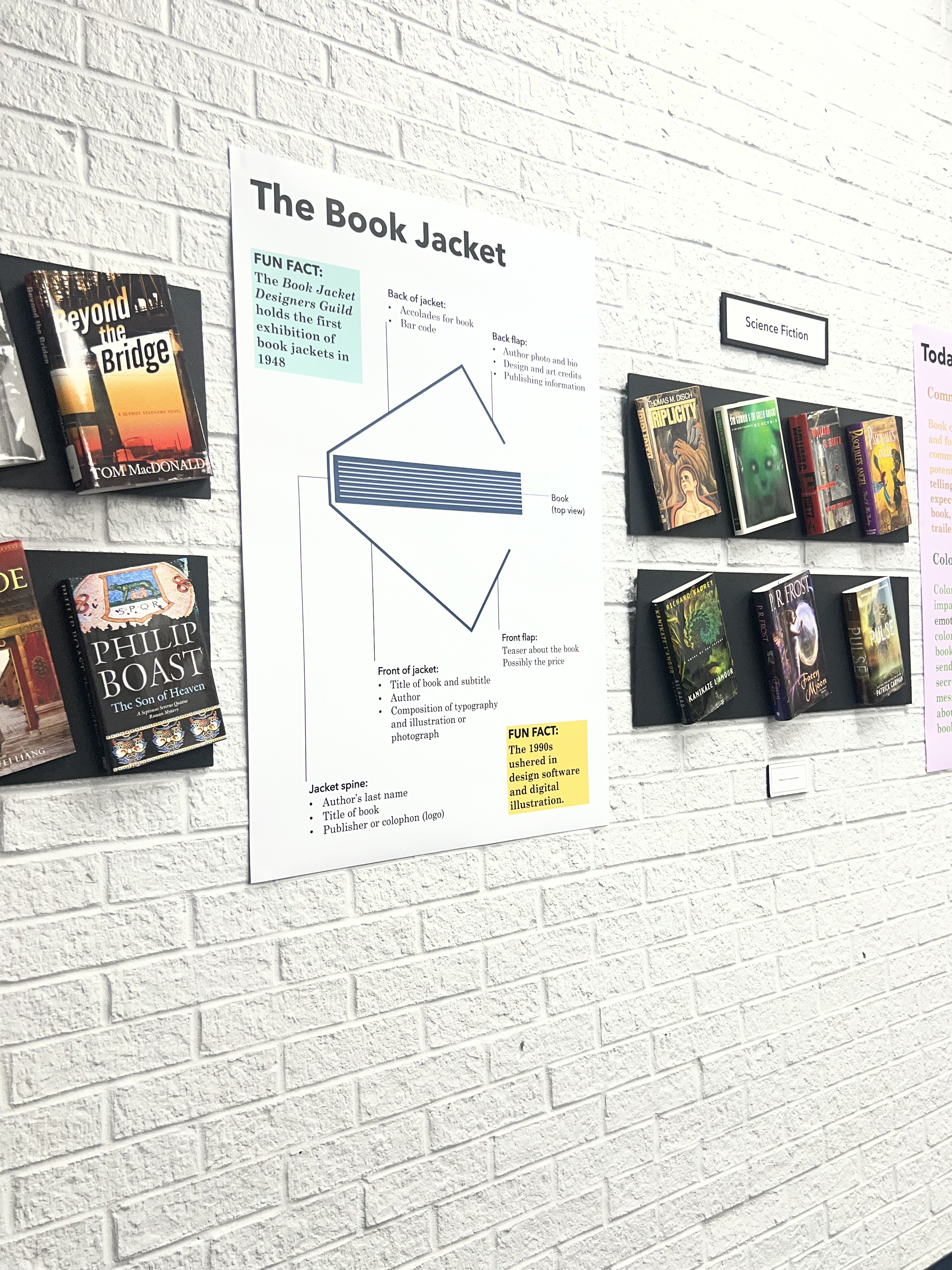 Various covers for classic books on display in the Art of the Cover exhibit. 