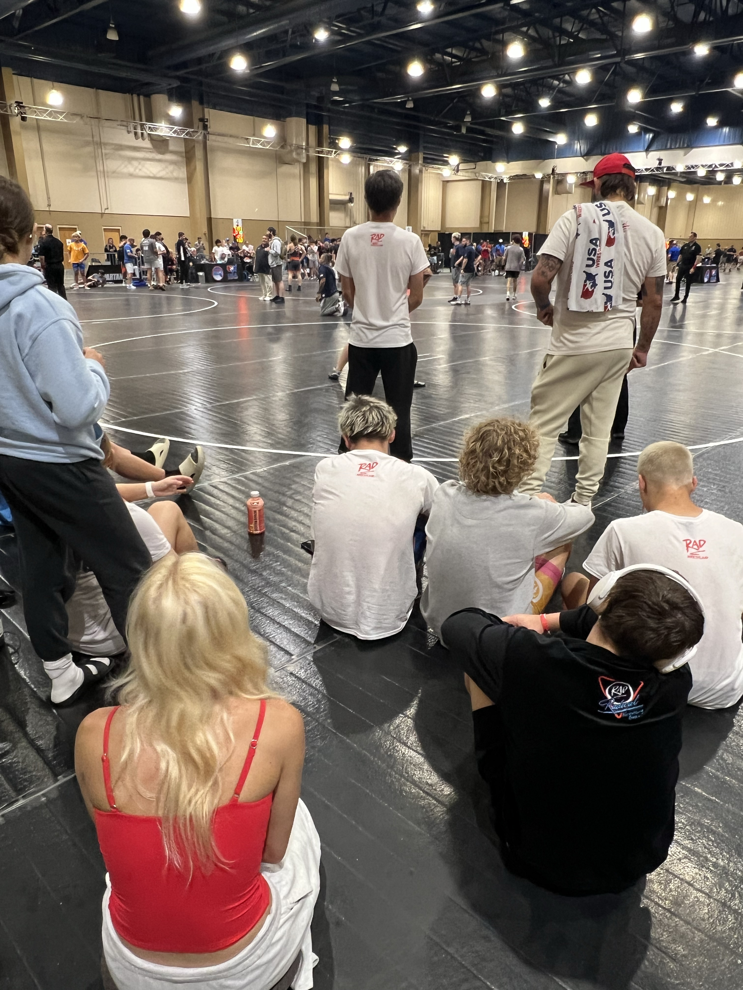 Journey and Lucas Flannery sit together during wrestling matches in Panama City. Submitted