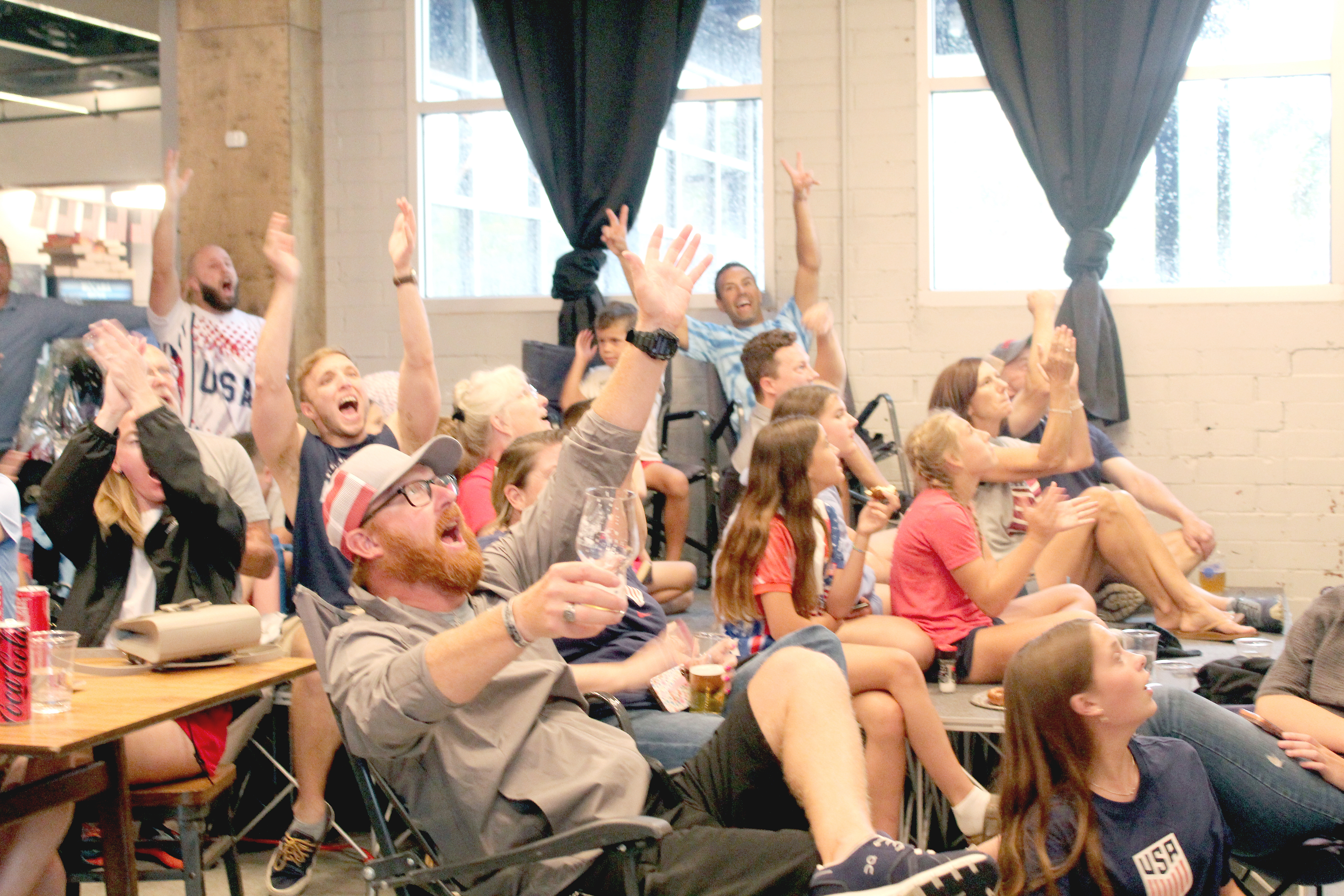 World Cup watchers at Mocama celebrate during the USA Men’s National Team’s game against on Australia on June 19. News-Leader