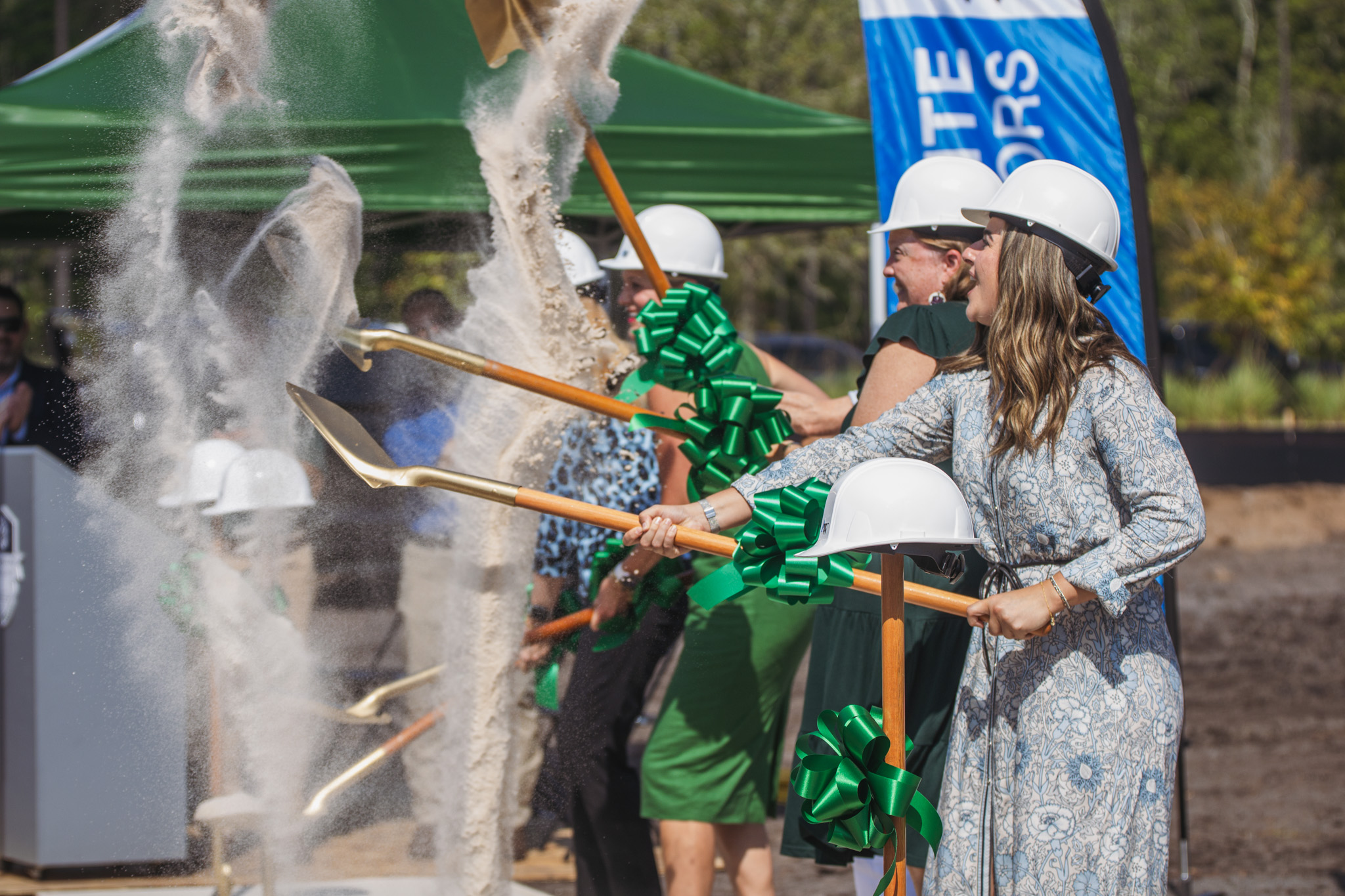 Izabelle Sala, assistant principal at Cornerstone Classic Academy in Jacksonville, right, and other academy leaders take part in a ground-breaking ceremony at the school’s new location in Wildlight. It will be the first charter school in the county. Nick Blank/News-Leader