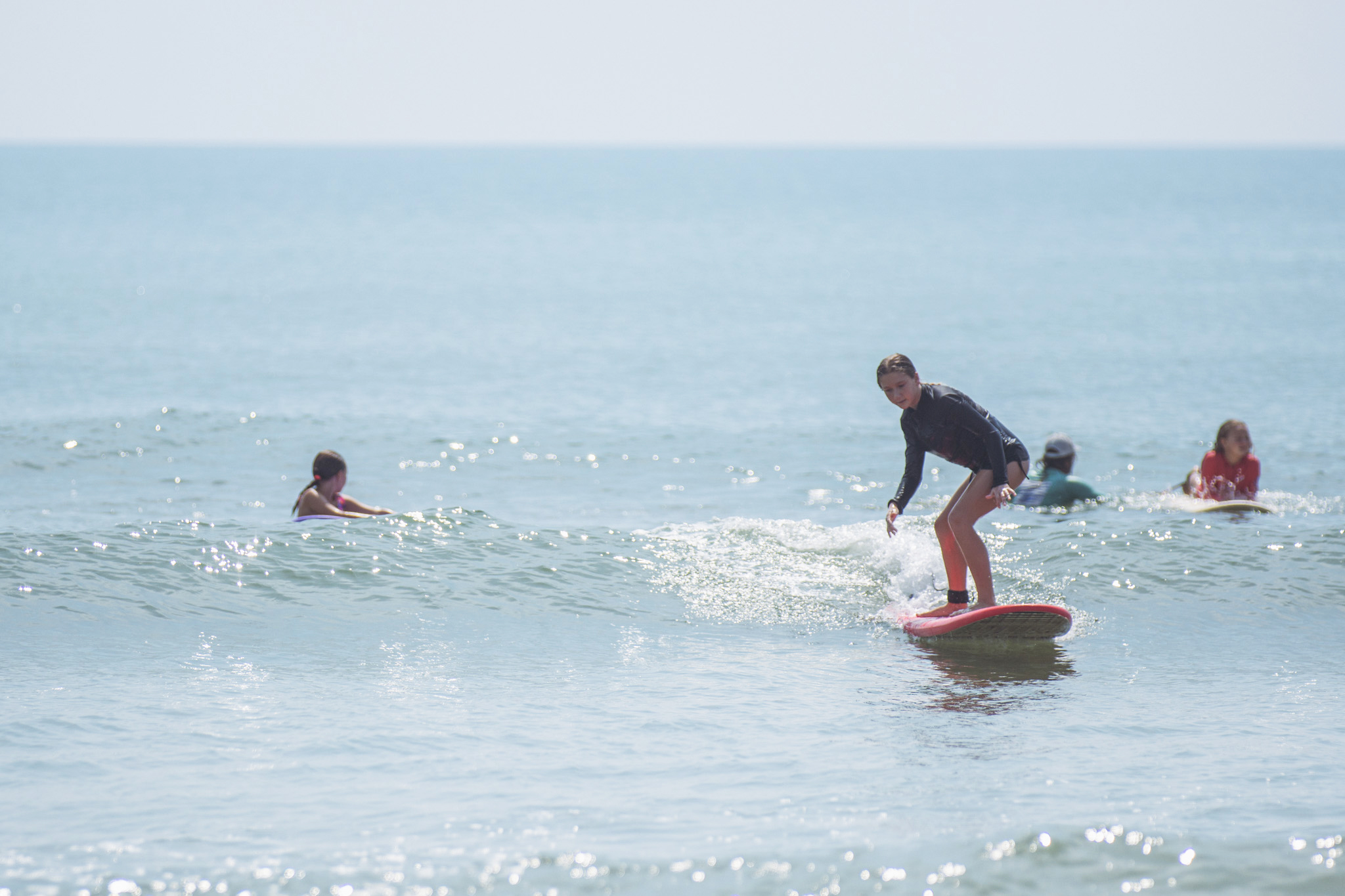 Local youth take part in the Surf Asylum clinic Monday morning on Amelia Island. Photo by Ashley Chandler/News-Leader