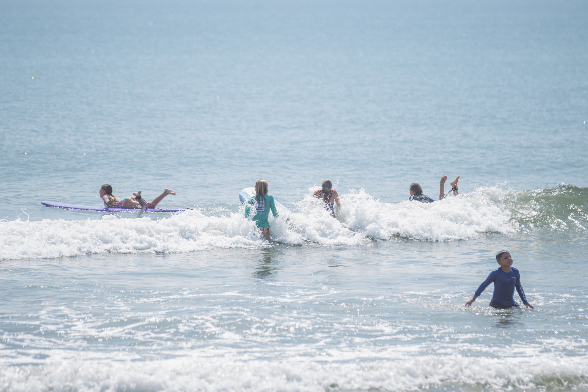 Local youth take part in the Surf Asylum clinic Monday morning on Amelia Island. Photo by Ashley Chandler/News-Leader